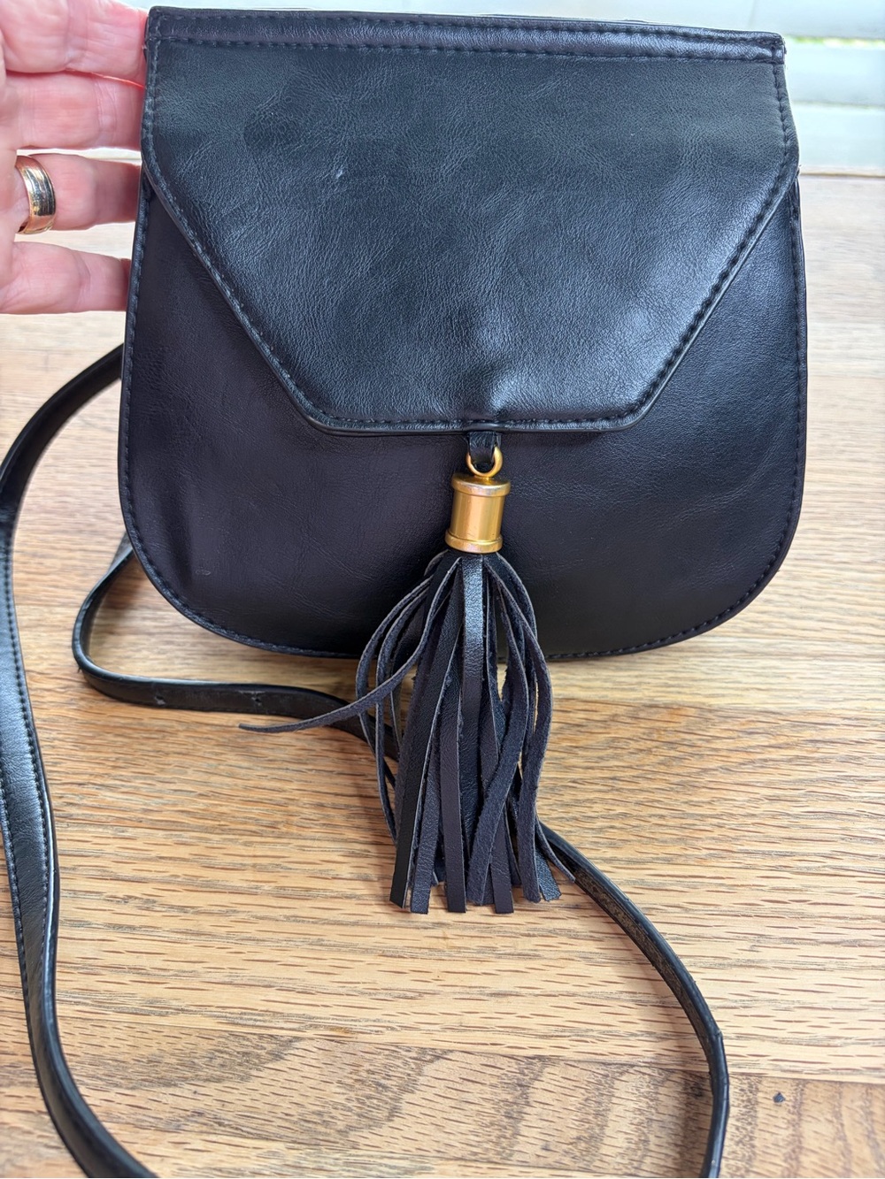 Big Buddha Black Crossbody Bag with Tassel and Gold Accent